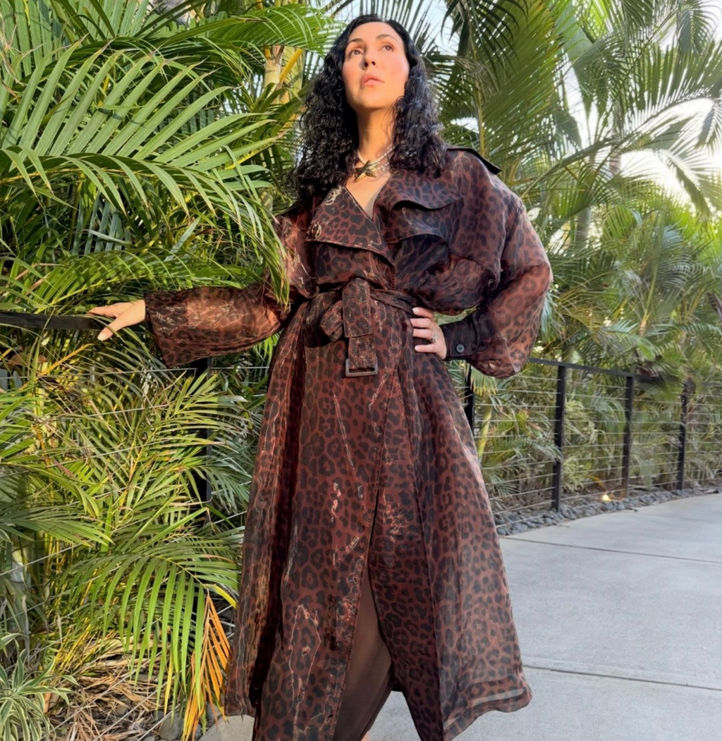 HAWA by AZALI showcasing a stylish, modern design with vibrant colors in a well-lit setting. leopard print, sheer organza, trench coat